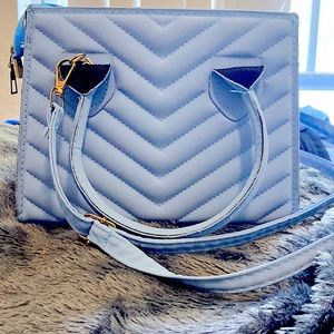 Light Blue Purse got it as a gift not sure where it’s from .